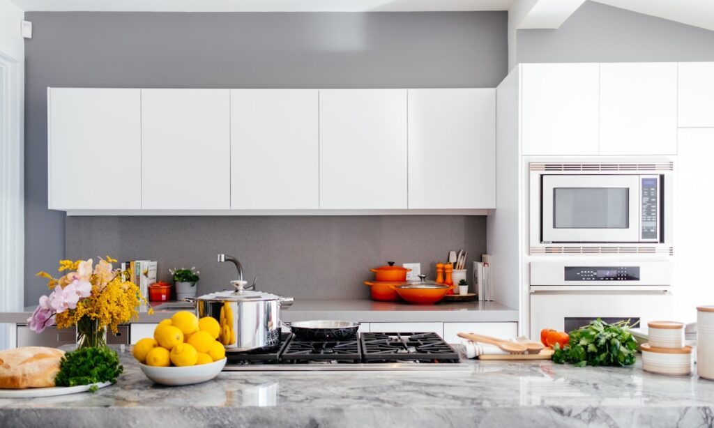 Craftsman working in a bright modern kitchen workshop